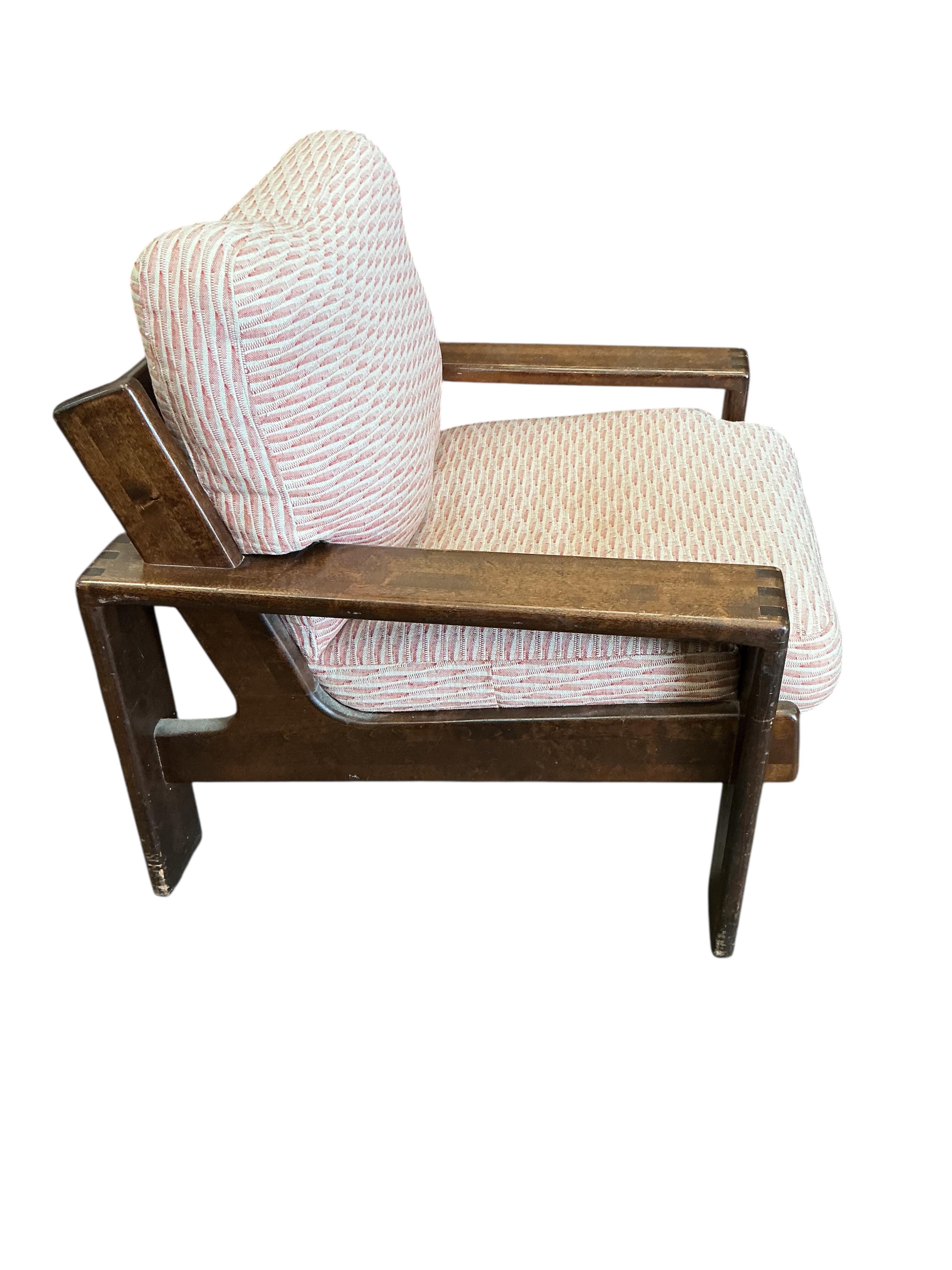 A pair of Arts & Crafts style walnut armchairs with loose cushion seats and backs, width 80cm, depth 80cm, height 85cm